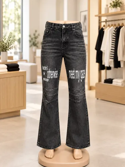 Charcoal graphic flare jeans displayed on a mannequin
